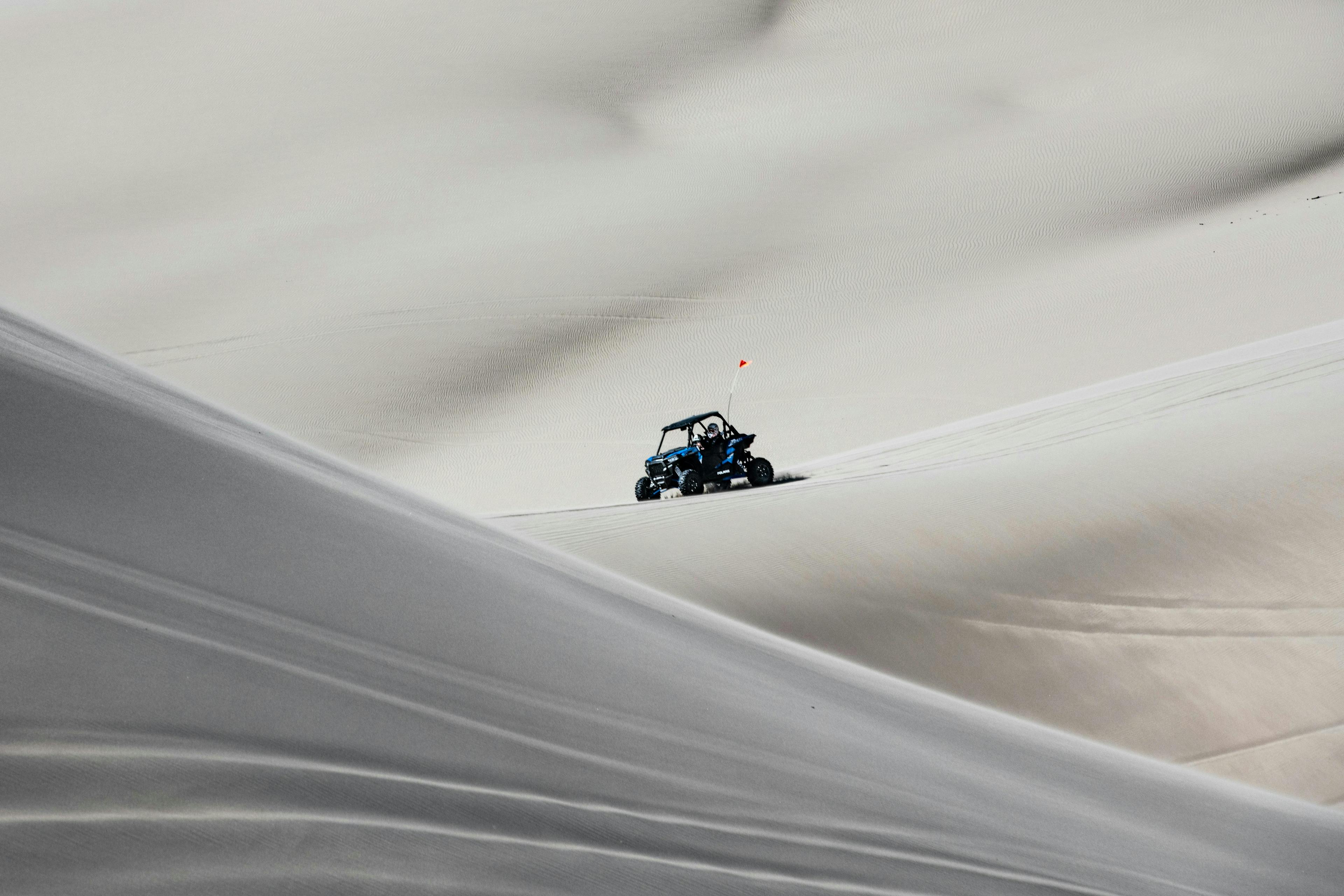 An ATV Races over sand dunes in St. Anthony in Yellowstone Teton Territory.