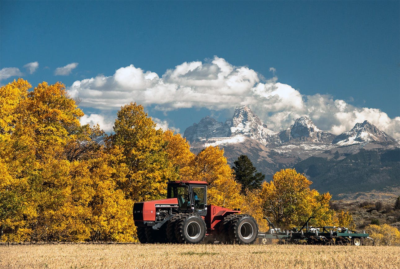 Harvesting crops in the Fall in Teton Valley, a part of the Yellowstone Teton Territory.