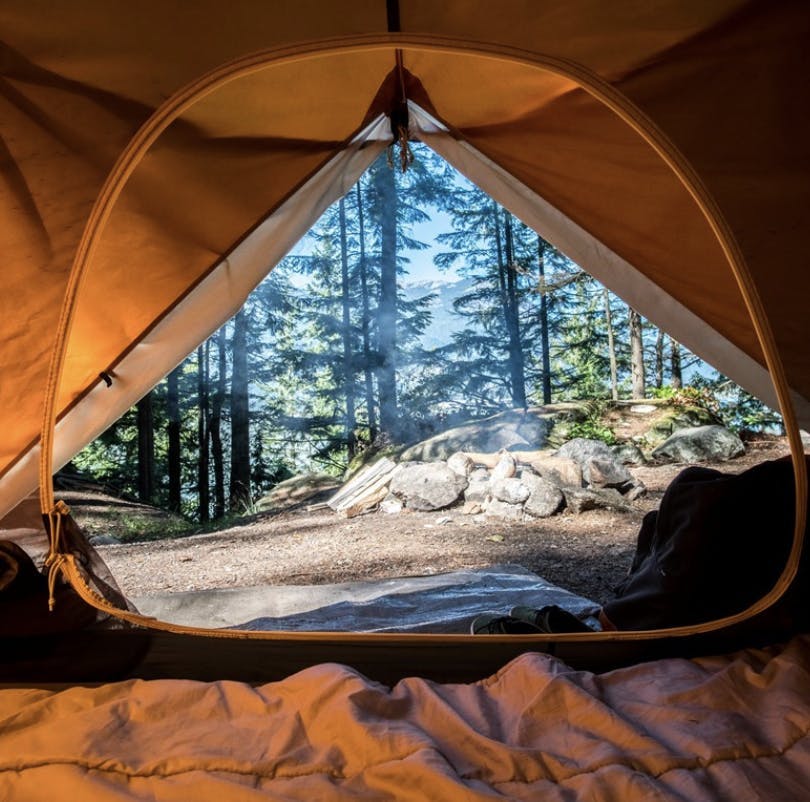 Tent opening overlooking a dispersed campground in Eastern Idaho, a part of Yellowstone Teton Territory.