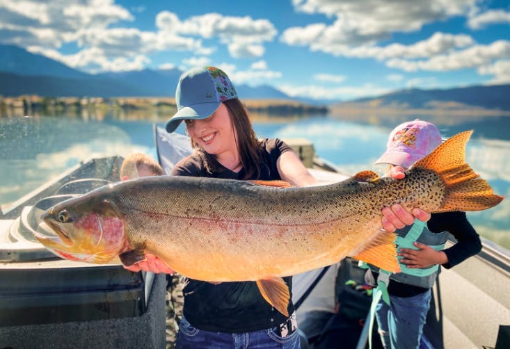 Catching a rainbow trout on Henry's Lake at the State Park in Island Park, ID in Yellowstone Teton Territory.