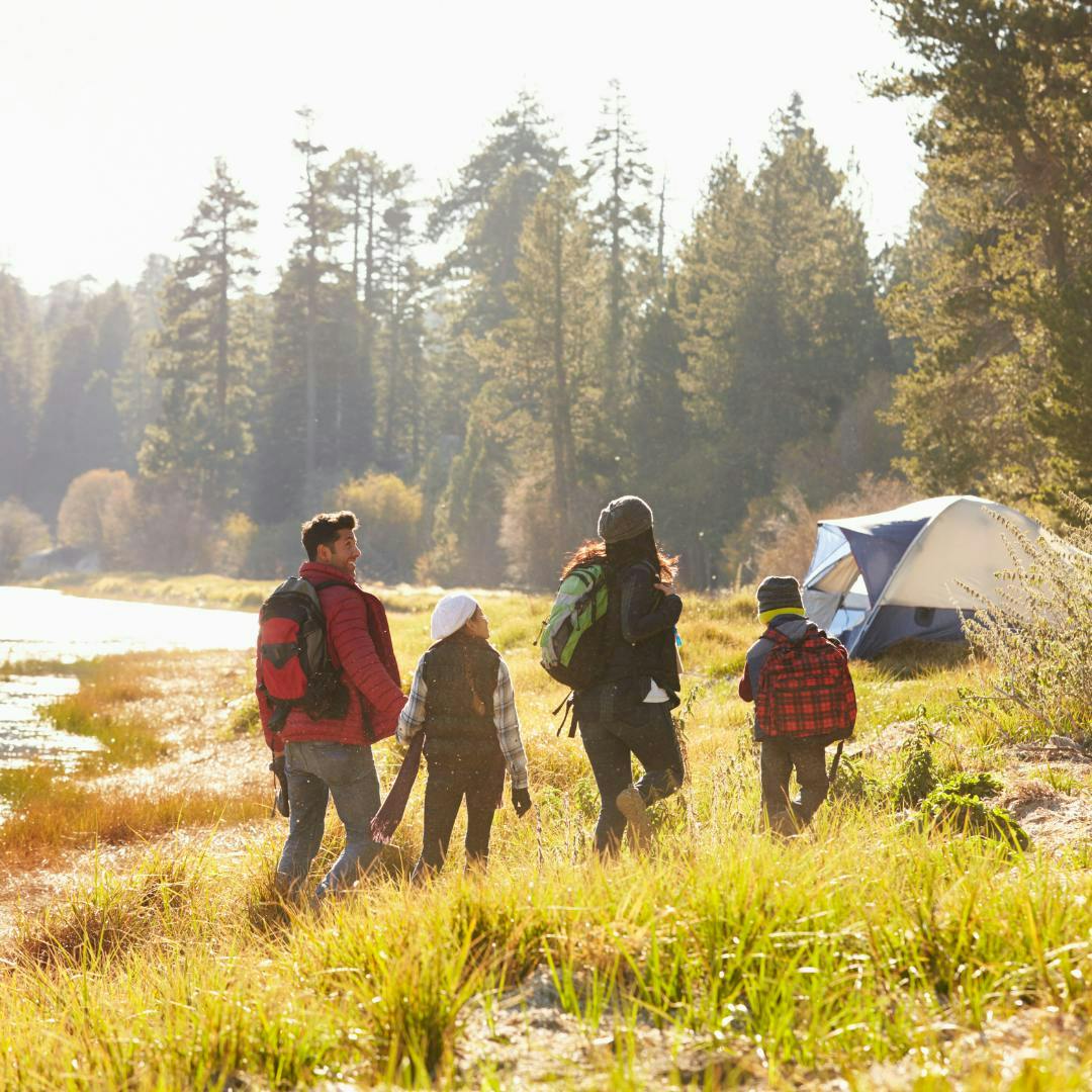 A family camping in the Fall outside of Rexburg ID in Yellowstone Teton Territory.