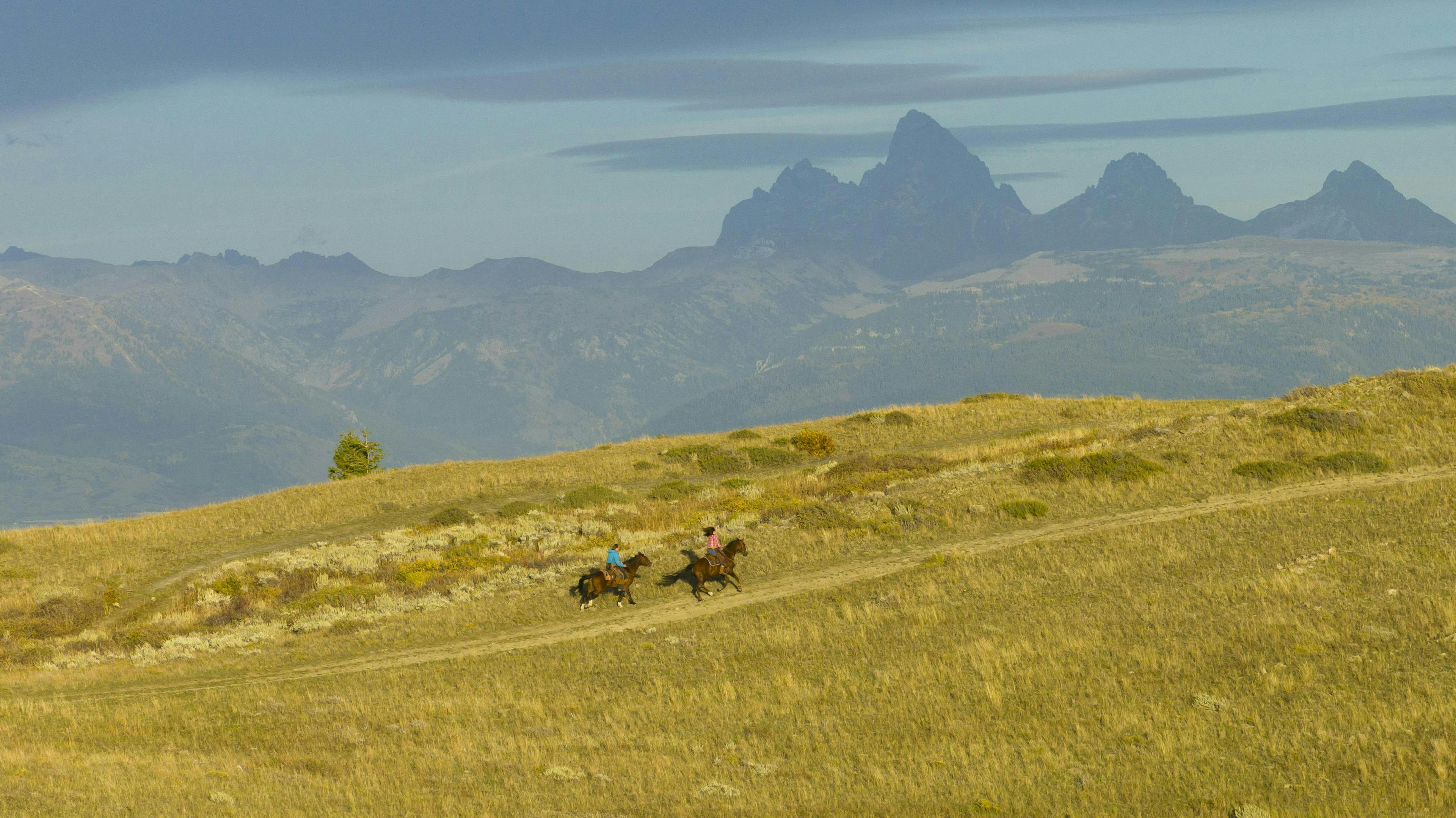 Riding horses in the Fall in Eastern Idaho's Teton Valley, a part of Yellowstone Teton Territory.