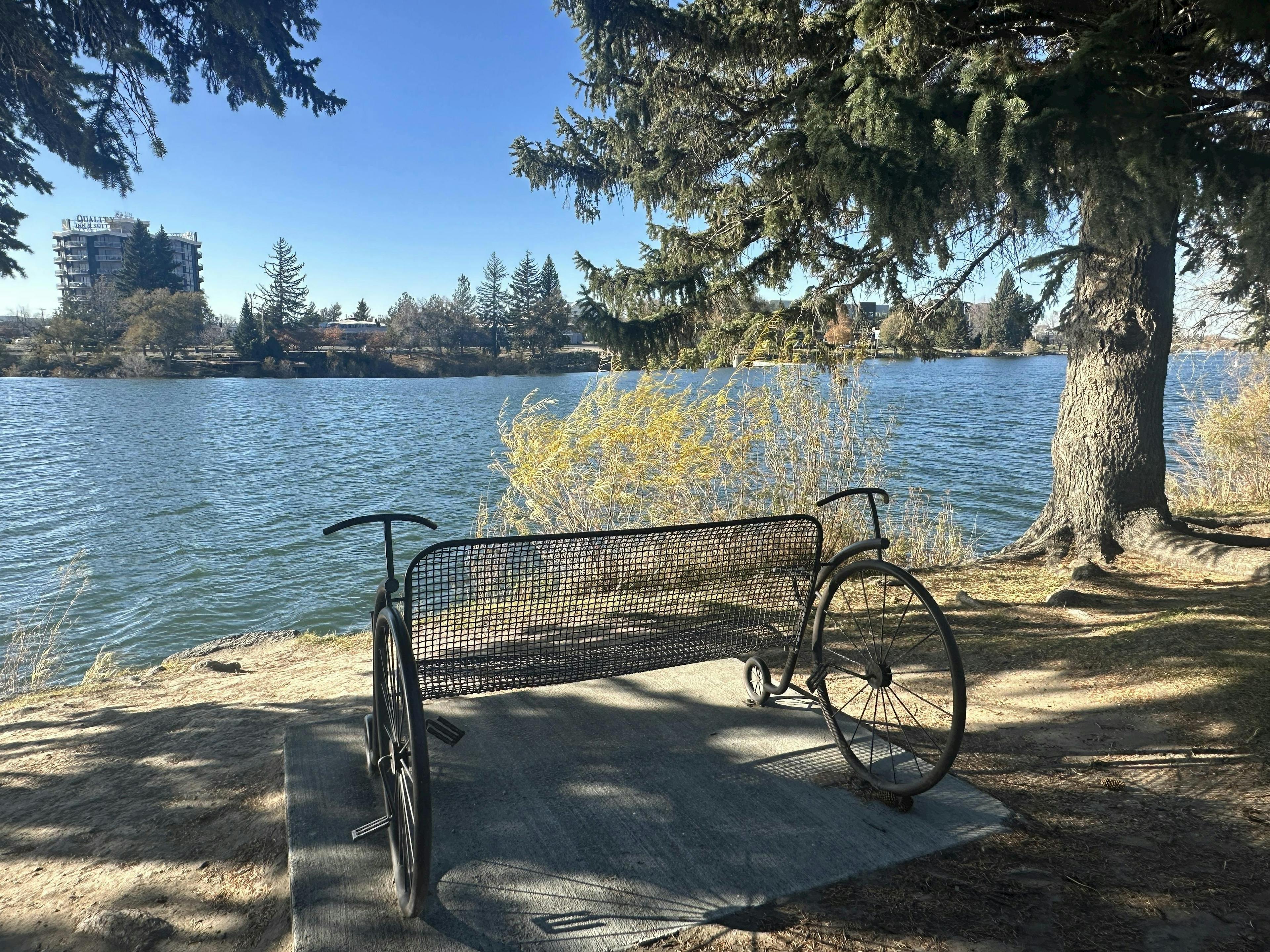 A park bench on the Idaho Falls Greenbelt and Riverwalk in Eastern Idaho along the Snake River.