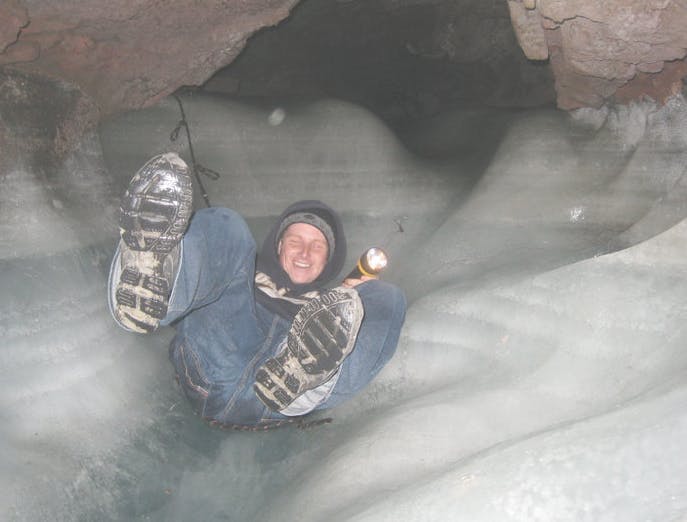 Sliding down the ice cave outside of St. Anthony Idaho in Yellowstone Teton Territory.